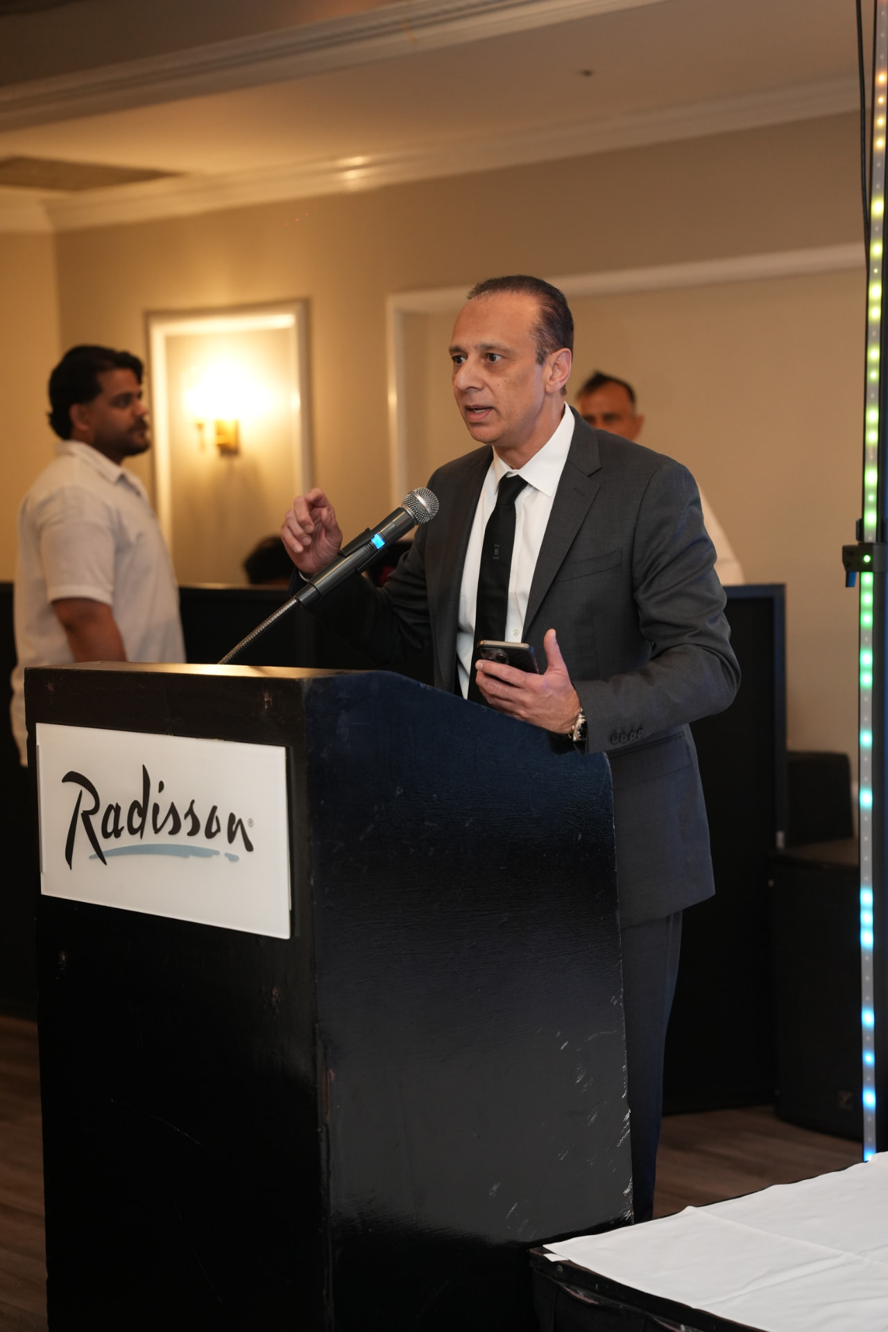 Dr. Imran Sharief speaking at a community event